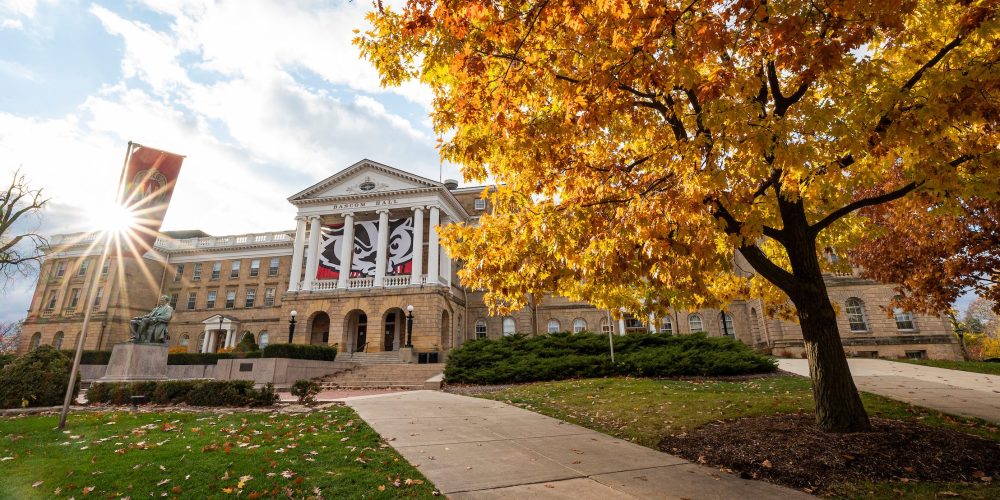 Pedestrians and students walk among the colors of the fall leaves near Bascom Hall at the University of Wisconsin-Madison during autumn on November 11, 2021. (Photo by Bryce Richter / UW-Madison)