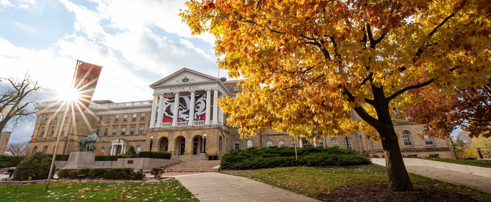 Pedestrians and students walk among the colors of the fall leaves near Bascom Hall at the University of Wisconsin-Madison during autumn on November 11, 2021. (Photo by Bryce Richter / UW-Madison)