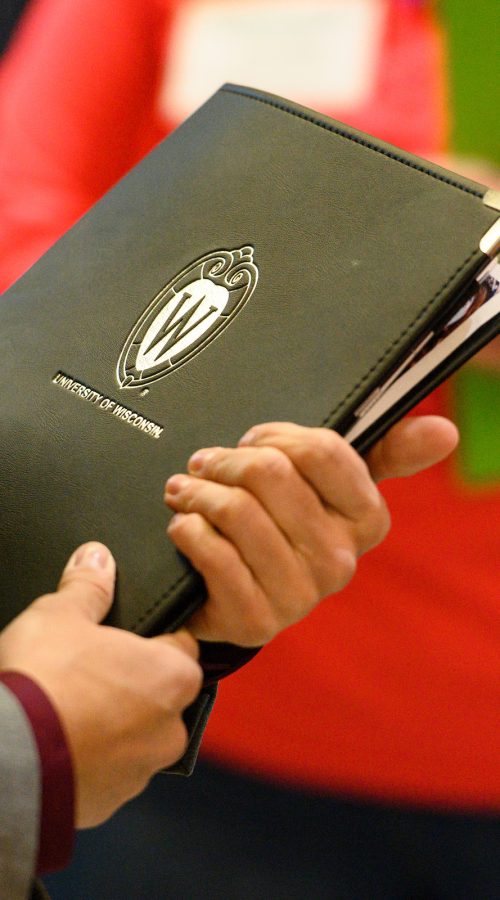 UW undergraduate Jacob Zabel talks with recruiter Stacey McMorrow from Covance during the annual Spring Career and Internship Fair held at the Kohl Center at the University of Wisconsin-Madison on Feb. 5, 2019. The fair featured 215 employers and was open to all current students and alumni. (Photo by Bryce Richter /UW-Madison)